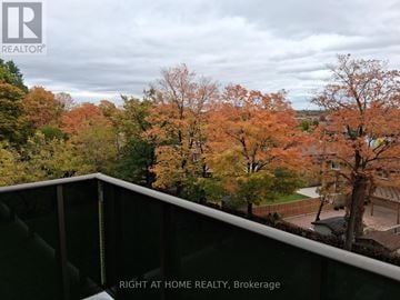 Toronto (Glenfield-Jane Heights) apartment for rent - A view from a balcony of a residential area with trees in autumn colors.
