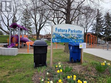 Toronto (Glenfield-Jane Heights) apartment for rent - A sign for Futura Parkette is in front of a playground.