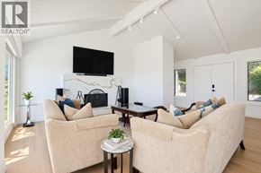 West Vancouver apartment for rent - A living room with two couches and a television mounted on the wall.