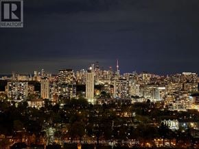 Toronto (Mount Pleasant West) condo for rent - A cityscape at night with the Empire State Building illuminated.