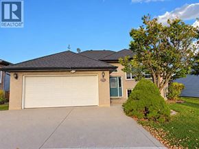 Windsor apartment for rent - A house with a brown roof and a white garage door.