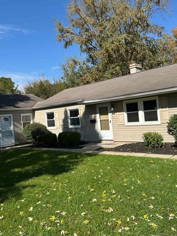 Columbus apartment for rent - A house with a grey roof and a white door.