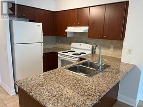 Markham (Unionville) condo for rent - A kitchen with granite countertops and stainless steel appliances.