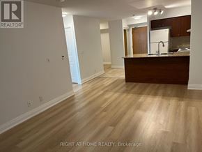 Markham (Unionville) condo for rent - A kitchen area with a counter and cabinets.
