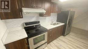 Markham (Milliken Mills East) apartment for rent - A kitchen with a stove, oven, sink, and refrigerator.