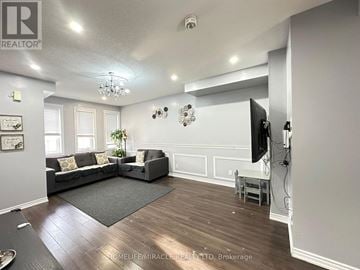Brampton (Heart Lake East) townhouse for rent - A living room with a grey couch and a television.