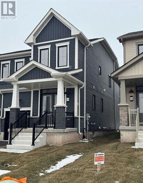 Welland (Dain City) apartment for rent - A house with a sign in front of it that says "For Sale".