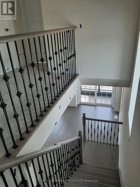 Brampton (Credit Valley) townhouse for rent - A staircase with a metal railing and wooden steps.