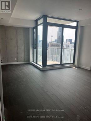 Toronto (Church-Yonge Corridor) condo for rent - A room with a view of the city skyline through large windows.