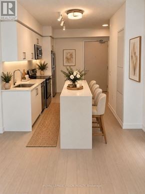Toronto (Humber Heights) condo for rent - A kitchen with a dining table and chairs.