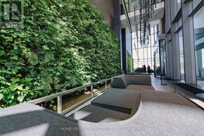 Toronto (Waterfront Communities) condo for rent - A living wall of green plants in a modern building.