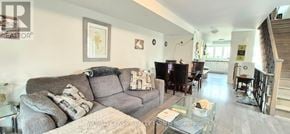 Oshawa (Windfields) townhouse for rent - A living room with a grey couch and a coffee table.