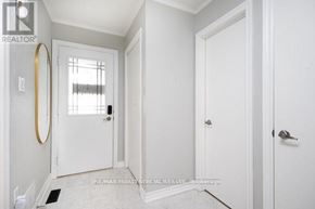 Milton (Tm Timberlea) apartment for rent - A white door with a gold handle is in a room with white walls.