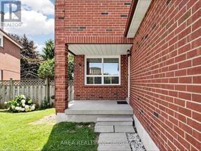 Mississauga (Hurontario) apartment for rent - A red brick house with a white door and windows.