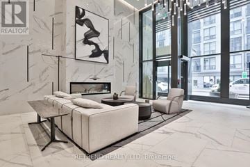 Toronto (Church-Yonge Corridor) condo for rent - A modern living room with a large sofa and a coffee table.
