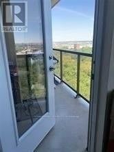 Toronto (West Humber-Clairville) condo for rent - A balcony with a glass door leading to a view of the city.