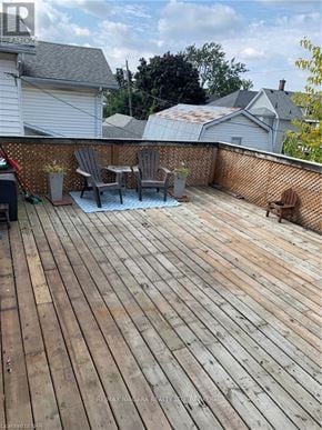 Welland (Welland Downtown) apartment for rent - A wooden deck with chairs and a table.