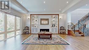 Toronto (Lansing-Westgate) apartment for rent - A spacious living room with a fireplace and a staircase.