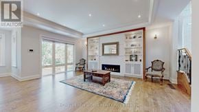 Toronto (Lansing-Westgate) apartment for rent - A spacious living room with a fireplace and a rug.