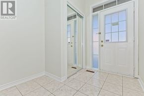 Milton (Cl Clarke) townhouse for rent - A white door with a glass panel and a gold handle is in a room with white walls.