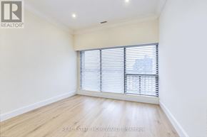 Toronto (Waterfront Communities) condo for rent - A room with a window covered by white blinds.