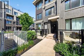 Mississauga (Erin Mills) townhouse for rent - A building with a balcony and a tree in front of it.
