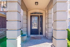 Oakville (Go Glenorchy) apartment for rent - A house entrance with a black door and a glass window.