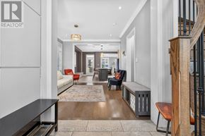 Oakville (Go Glenorchy) apartment for rent - A hallway with a red chair and a black bench.