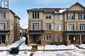 Oakville (Jm Joshua Meadows) townhouse for rent - A row of houses with snow on the ground.