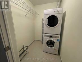Toronto (Bay Street Corridor) condo for rent - A white washer and dryer in a small laundry room.