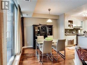 Toronto (Bay Street Corridor) condo for rent - A dining area with a table and chairs is shown in the image.