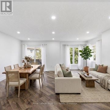 Cambridge townhouse for rent - A well-lit, spacious living room with a dining table and a couch.