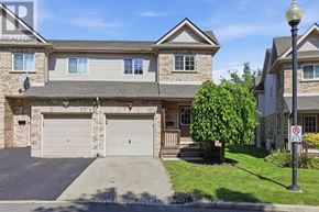 Cambridge townhouse for rent - A house with a garage and a no parking sign in front.