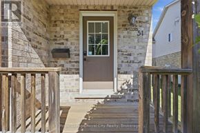 Cambridge townhouse for rent - A brown door is on a stone house.