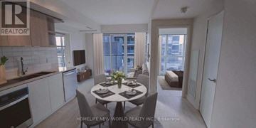 Toronto (Flemingdon Park) condo for rent - A dining room with a table set for two and a kitchen area with white cabinets.