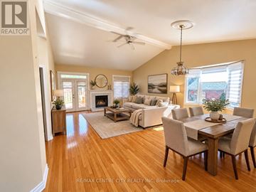 London North (North A) townhouse for rent - A well-lit living room with a dining table set up.