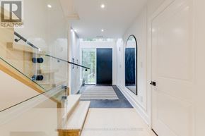 Toronto (Birchcliffe-Cliffside) apartment for rent - A hallway with a glass railing and a white door.