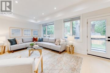 Toronto (Birchcliffe-Cliffside) apartment for rent - A living room with a white couch and a coffee table.