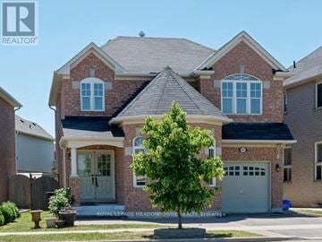 Milton (Co Coates) apartment for rent - A large brick house with a tree in front.