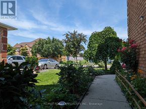 Mississauga (Lisgar) apartment for rent - A residential area with a clear sky and a pathway leading to a house.
