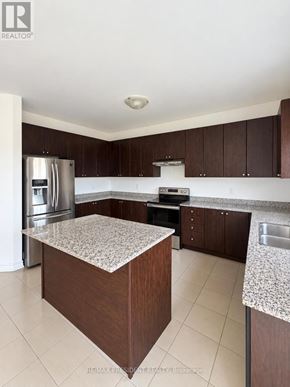 Southgate apartment for rent - A kitchen with a granite countertop and stainless steel appliances.