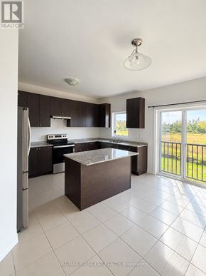 Southgate apartment for rent - A kitchen with a refrigerator, stove, and sink.