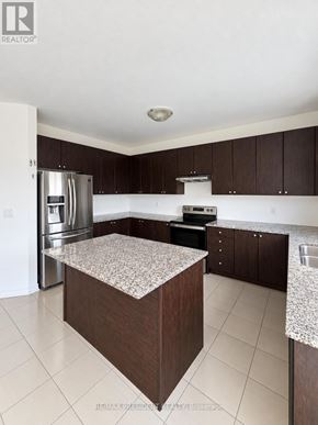 Southgate apartment for rent - A kitchen with a granite countertop and stainless steel appliances.