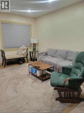 Windsor apartment for rent - A living room with a couch, chair, and coffee table.