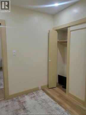 Windsor apartment for rent - A room with a closet and a rug on the floor.