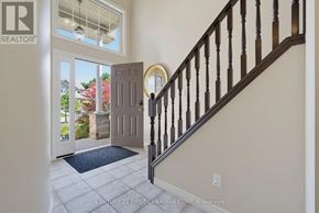 London North (North I) apartment for rent - A staircase with a wooden banister and a doorway leading to a balcony.