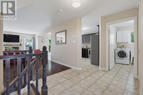 London North (North I) apartment for rent - A spacious living room with a washer and dryer in the corner.