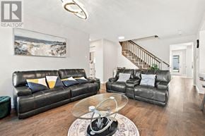 Ottawa apartment for rent - A living room with a leather couch and a glass coffee table.