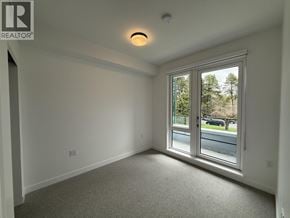 Vancouver apartment for rent - A room with a window overlooking a street.