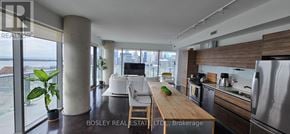 Toronto (Waterfront Communities) condo for rent - A modern kitchen with a view of the city.